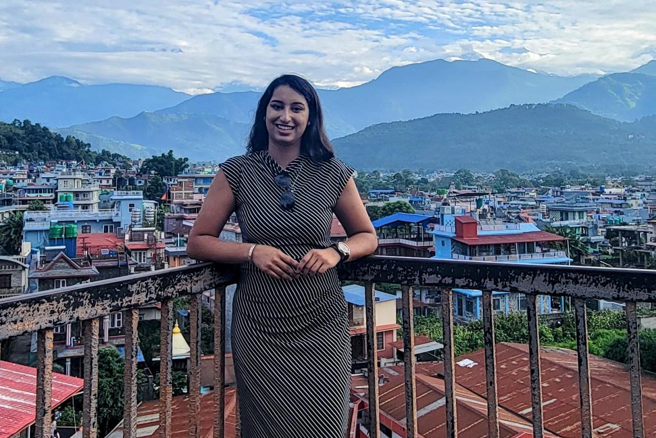 Aditi Mishra stands on balcony overlooking Kathmandu, Nepal